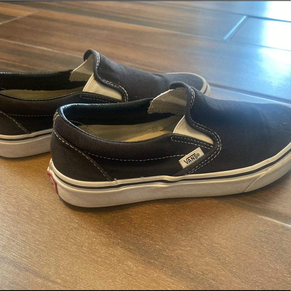 Black and white slip on vans